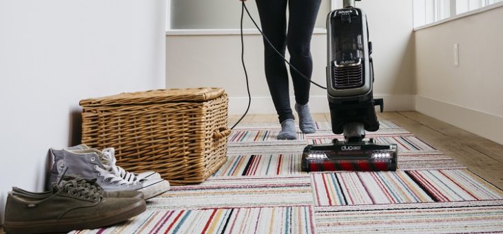 vacuuming the floor