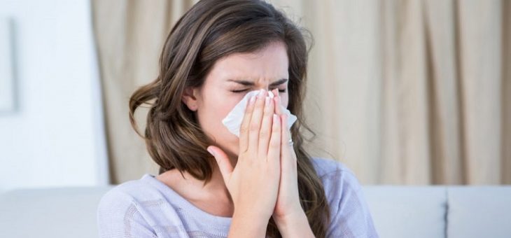 woman sneezing