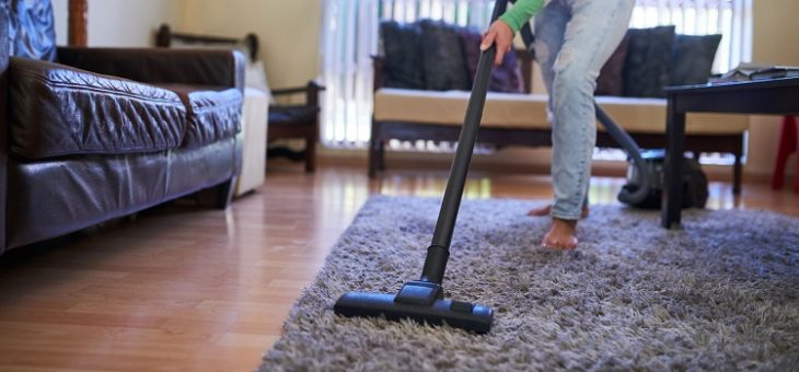 vacuuming the floor