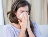 woman sneezing